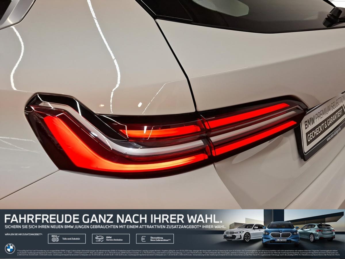 BMW 520i Touring von hinten in Weiß